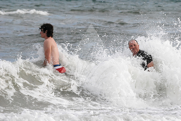Father and son enjoy surf