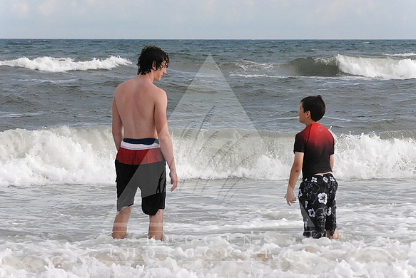 Two brothers discuss the surf