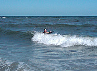 A boy rides Hatteras waves.