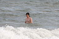 A young man in the surf